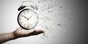 retro-black-alarm-clock-dissolving-into-little-particles-time-can-return-never-wait-anyone-time-management-concept (1) (2) (1)